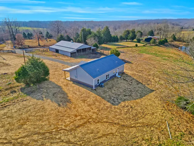 a view of a swimming pool with an outdoor seating
