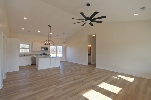 a view of kitchen with cabinets and wooden floor