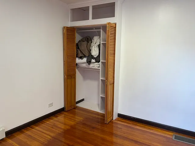 a view of a utility room with wooden floor washer and dryer