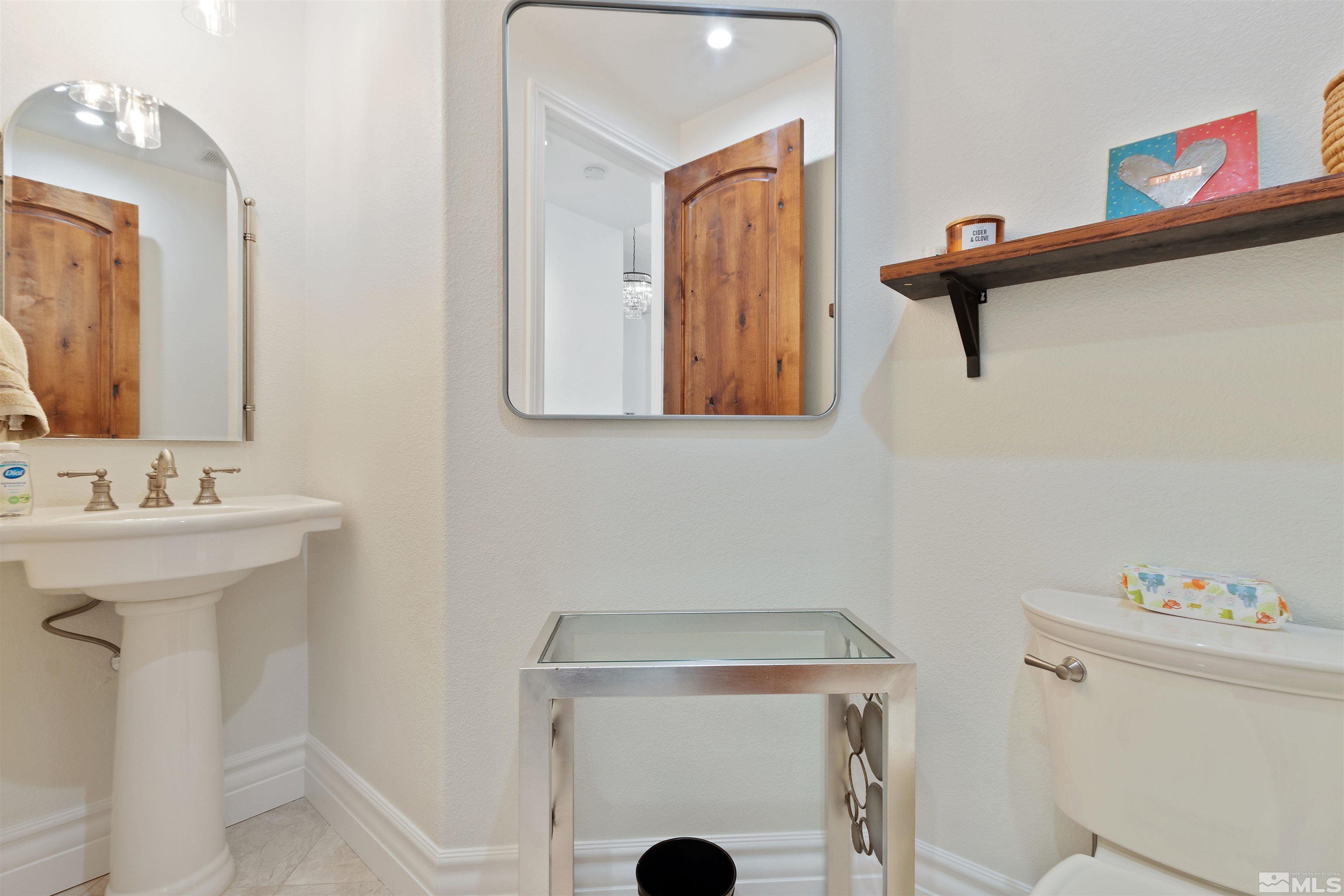 12825 Silver Wolf Road Reno, NV 89511 - Photo 17 of 34 a bathroom with a sink and a mirror