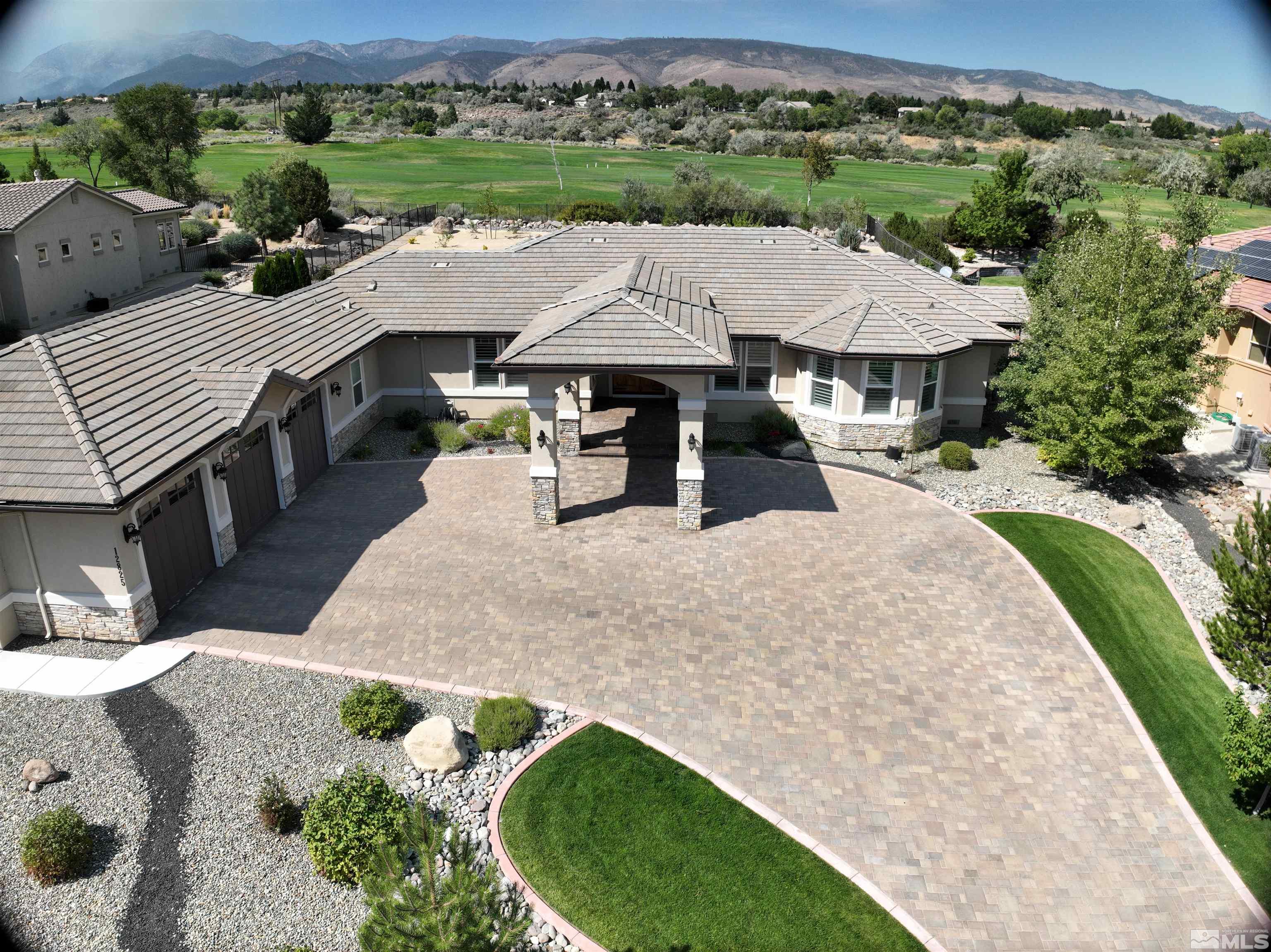 12825 Silver Wolf Road Reno, NV 89511 - Photo 2 of 34 an aerial view of a house with garden space and patio