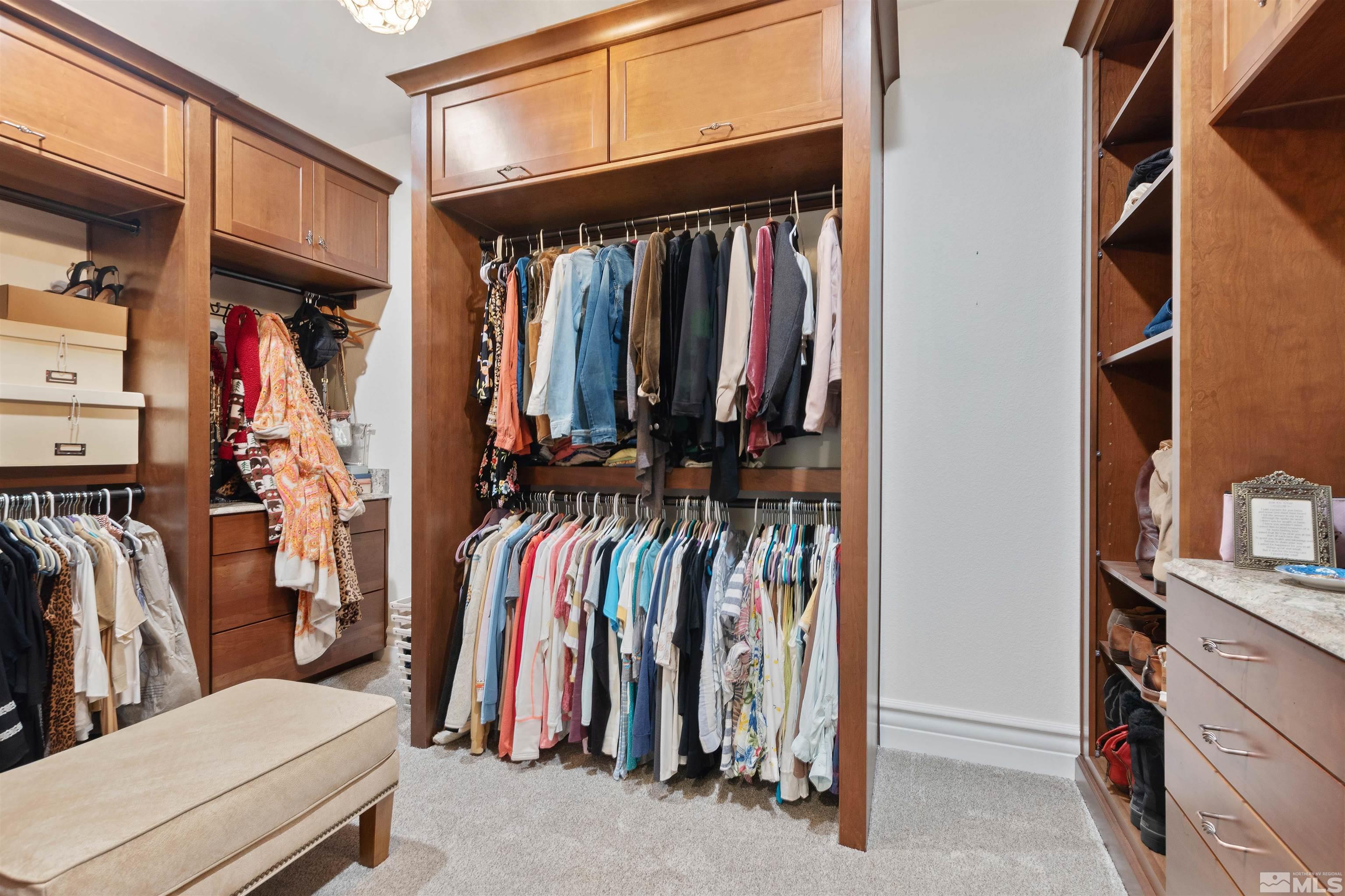 12825 Silver Wolf Road Reno, NV 89511 - Photo 24 of 34 a view of walk in closet with clothes and shoes