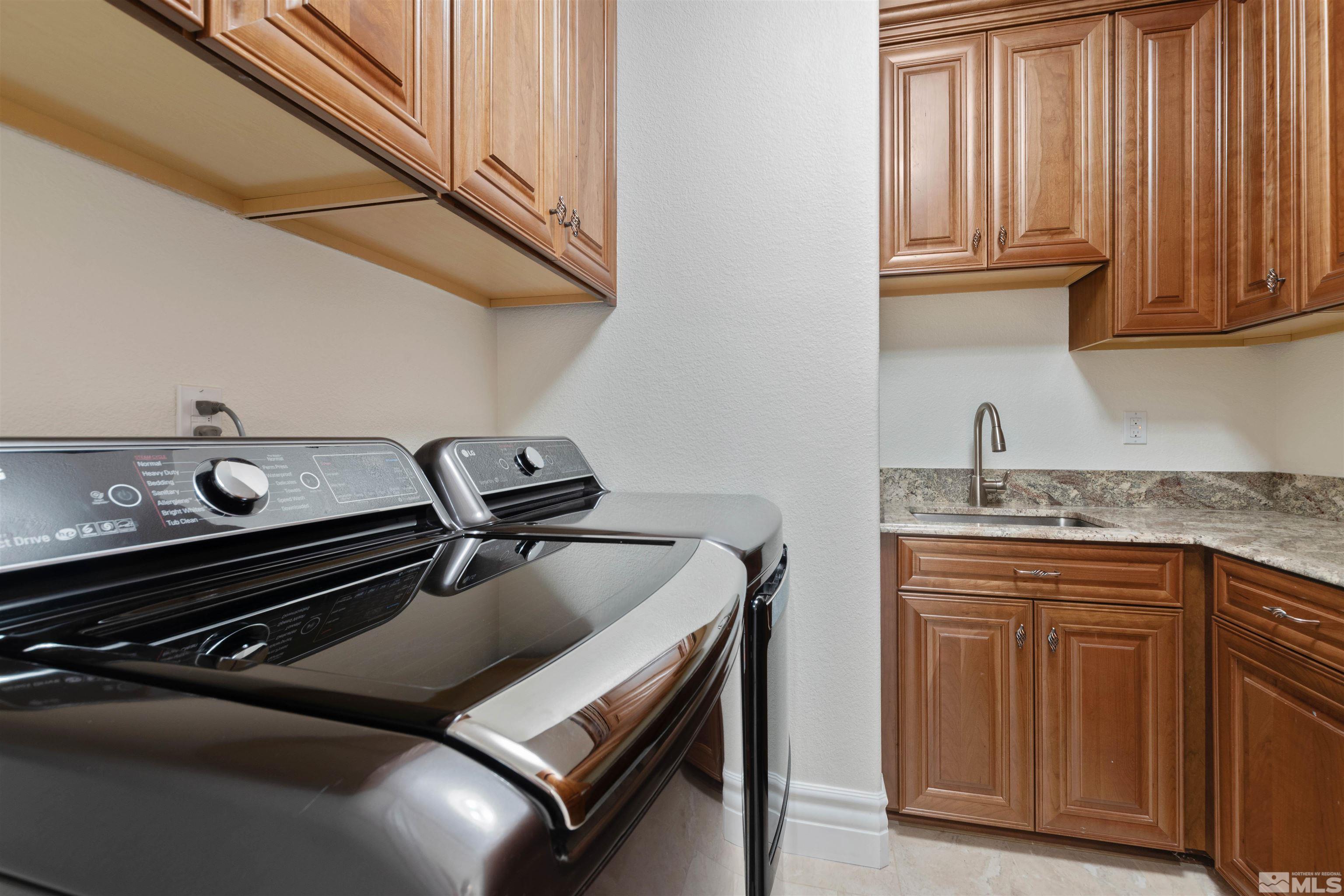 12825 Silver Wolf Road Reno, NV 89511 - Photo 27 of 34 a kitchen with a stove and a sink