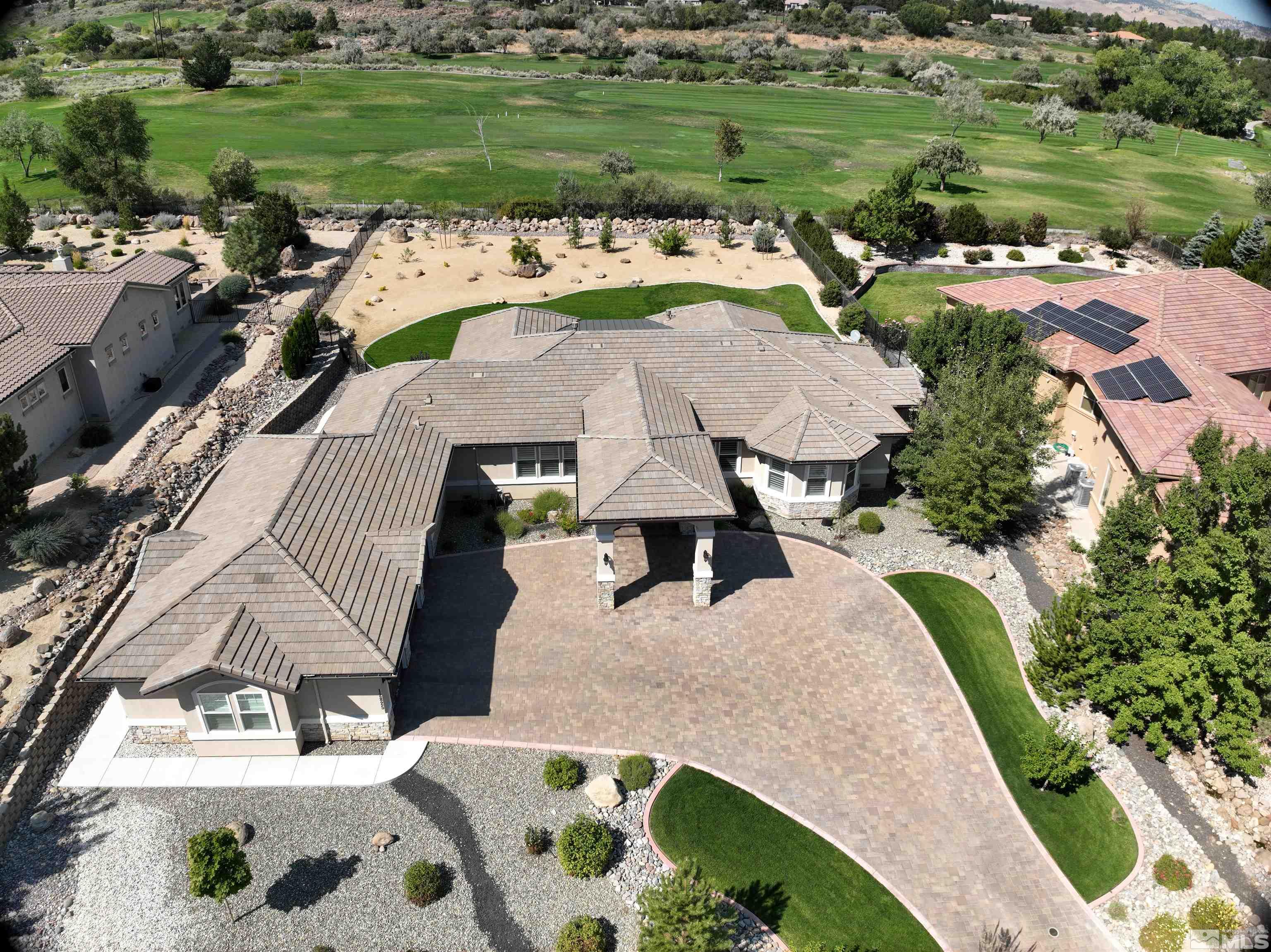 12825 Silver Wolf Road Reno, NV 89511 - Photo 32 of 34 a view of a lake with a yard