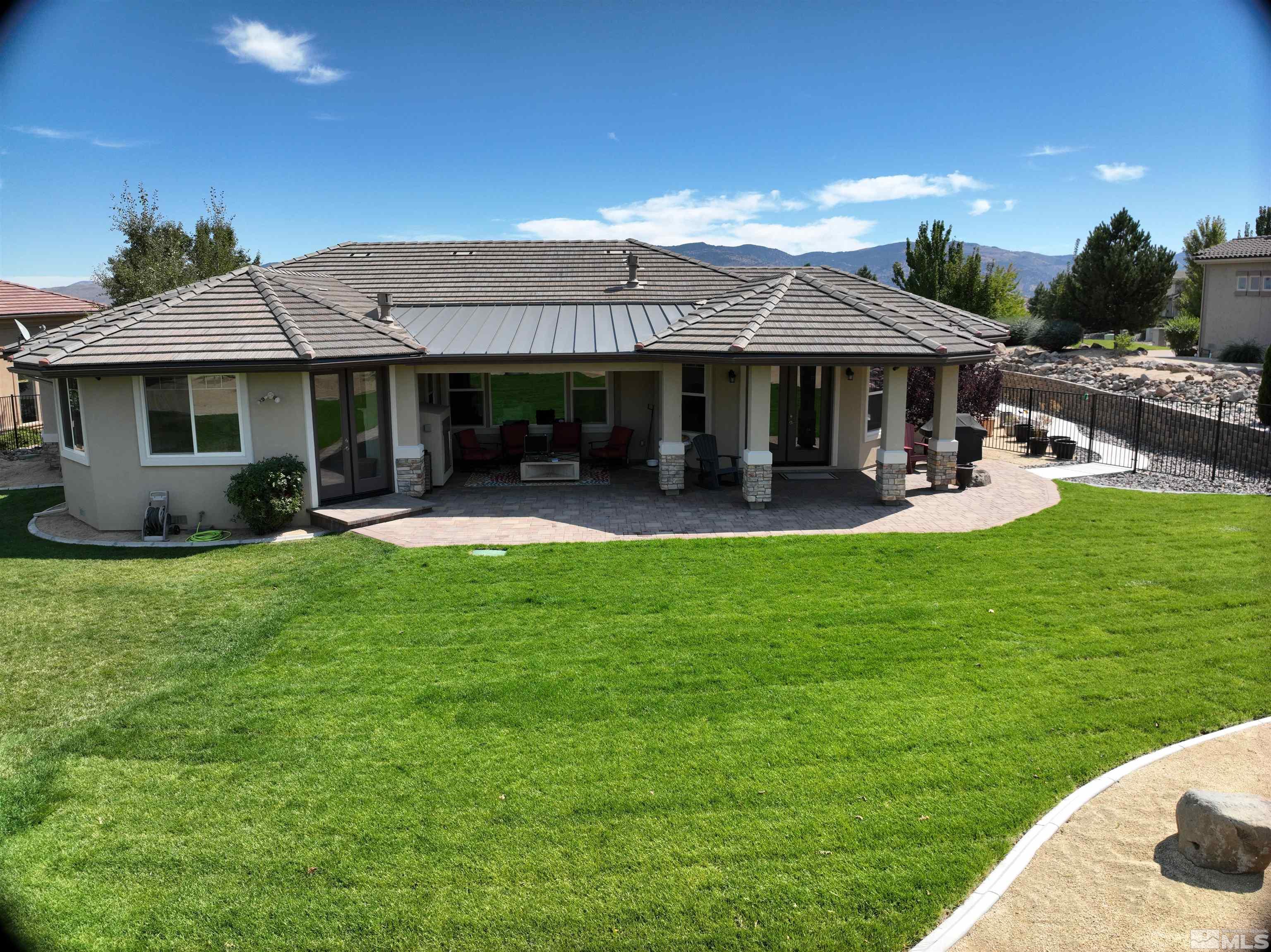 12825 Silver Wolf Road Reno, NV 89511 - Photo 34 of 34 a view of a house with backyard porch and sitting area