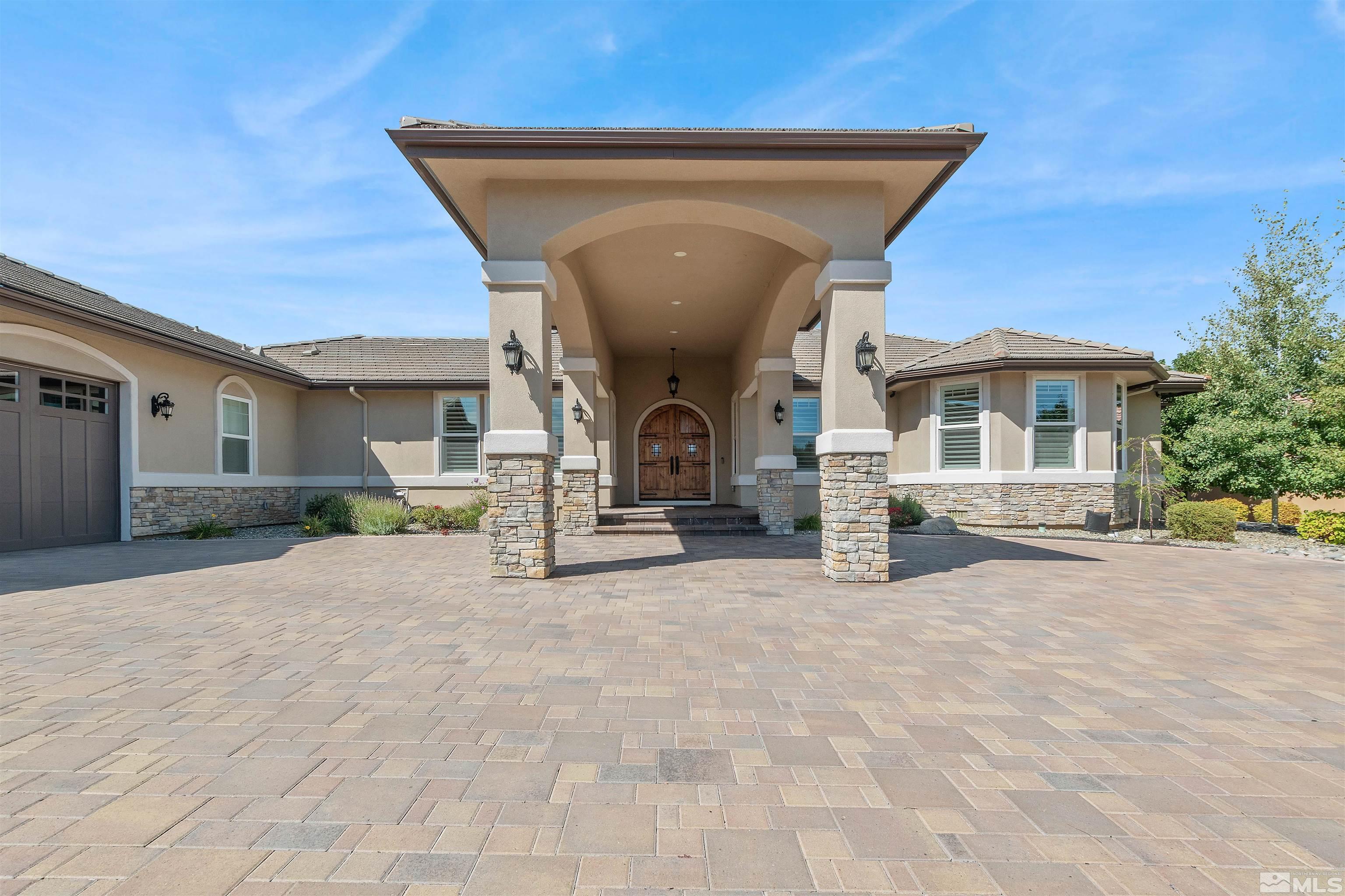 12825 Silver Wolf Road Reno, NV 89511 - Photo 4 of 34 a view of a house with patio