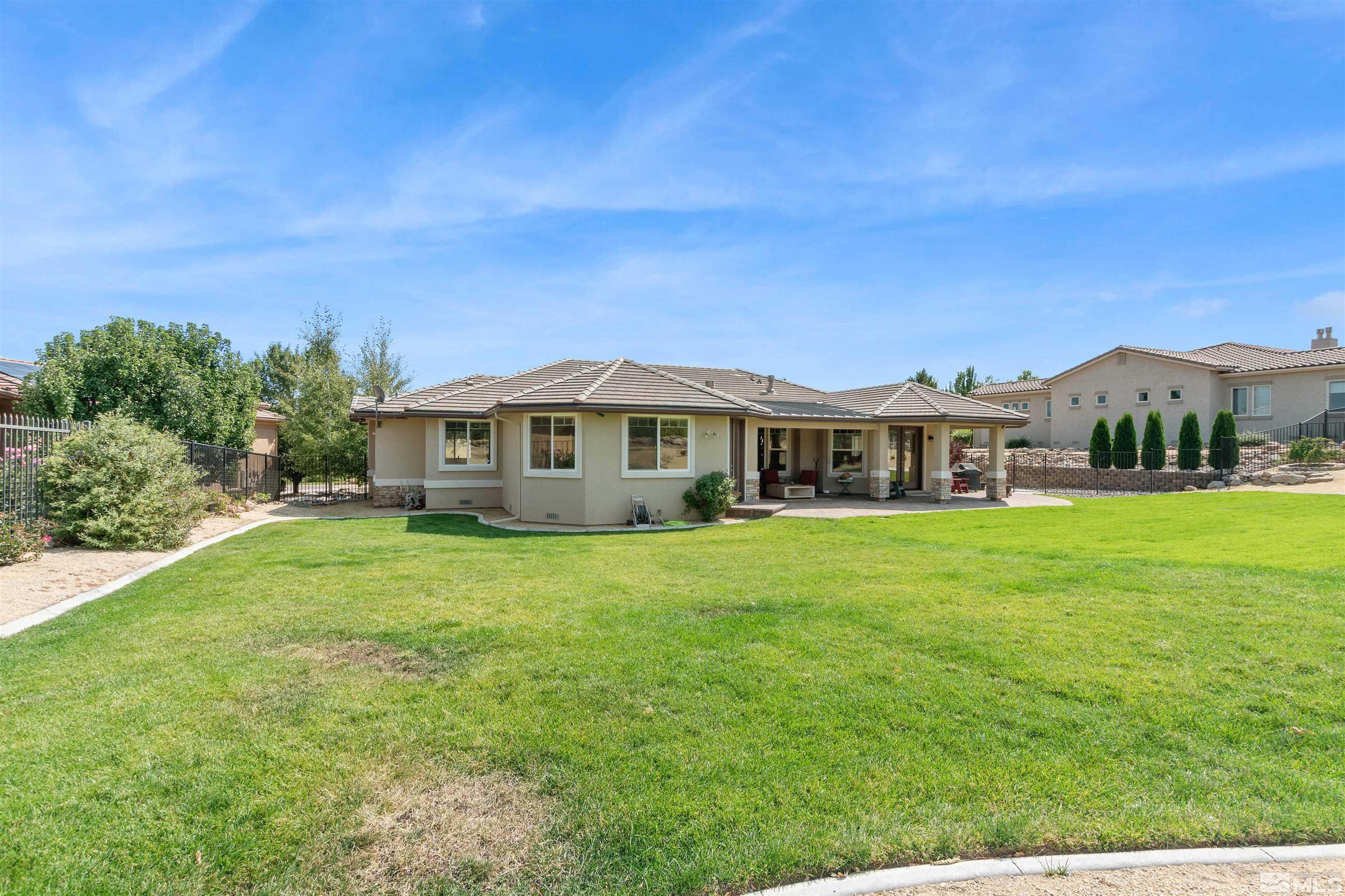 12825 Silver Wolf Road Reno, NV 89511 - Photo 6 of 34 a front view of a house with a garden