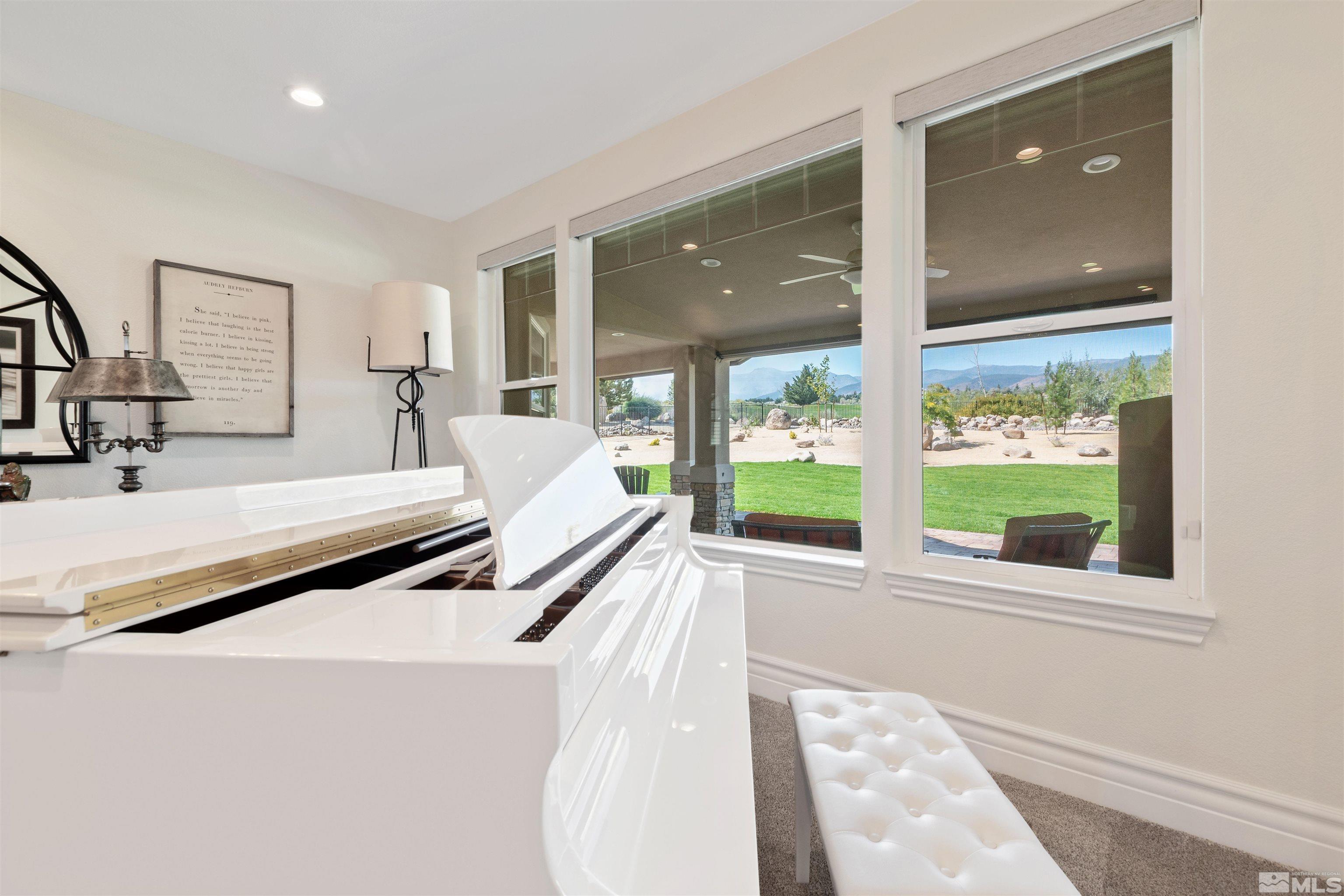 12825 Silver Wolf Road Reno, NV 89511 - Photo 10 of 34 a bedroom with a bed and large windows