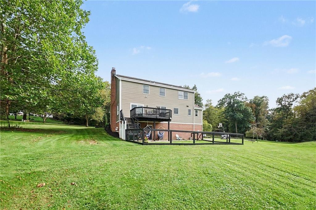 315 Fassinger Road Evans City, PA 16033 - Photo 27 of 32 Plenty of outdoor space with a deck, patio and a small fenced in space.