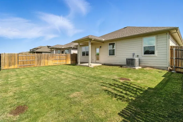 a view of a golf course with a lake view