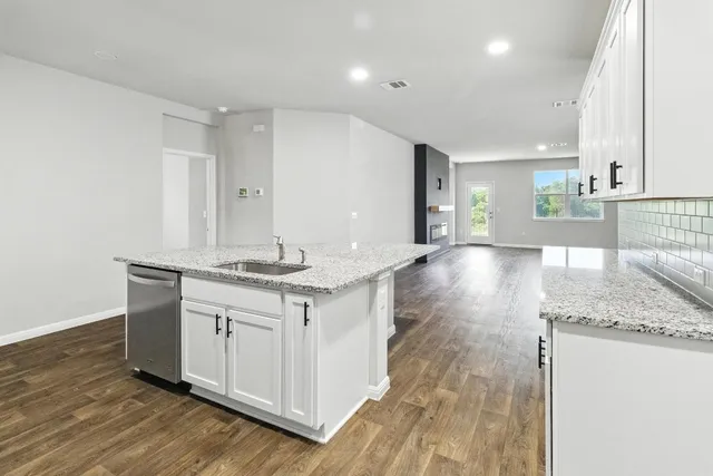 a bathroom with a sink double vanity granite and a mirror