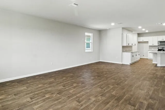 a view of kitchen with wooden floor and window