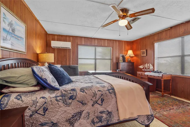 a bedroom with a large bed and a window