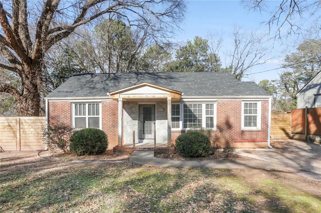 2702 Joyce Avenue Decatur, GA 30032 - Photo 1 of 1 a front view of a house with garden
