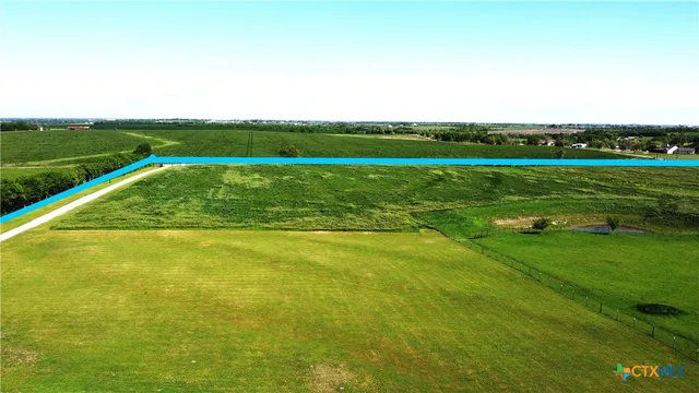 a view of a golf course with a lake
