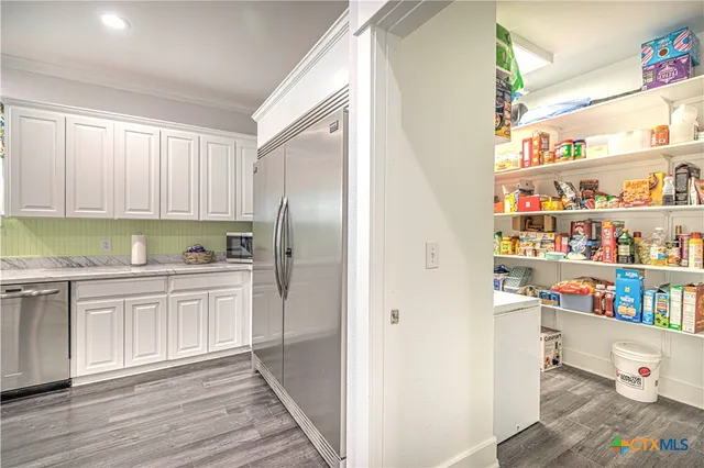 a room with furniture and a flat screen tv
