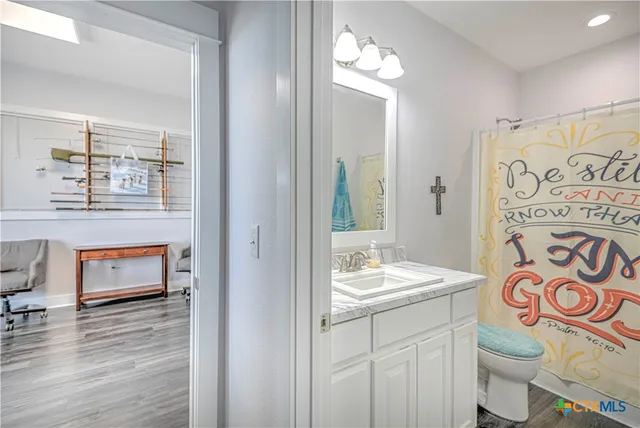 a spacious bathroom with a double vanity sink and a mirror