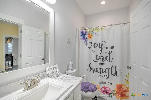 a bedroom with a bed and dresser