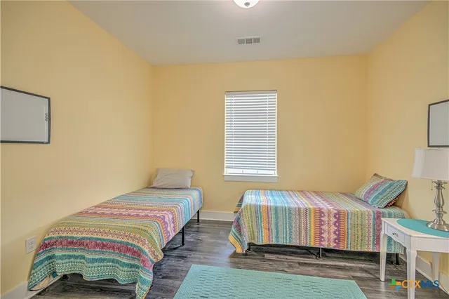 a spacious bathroom with a double vanity sink shower and a mirror