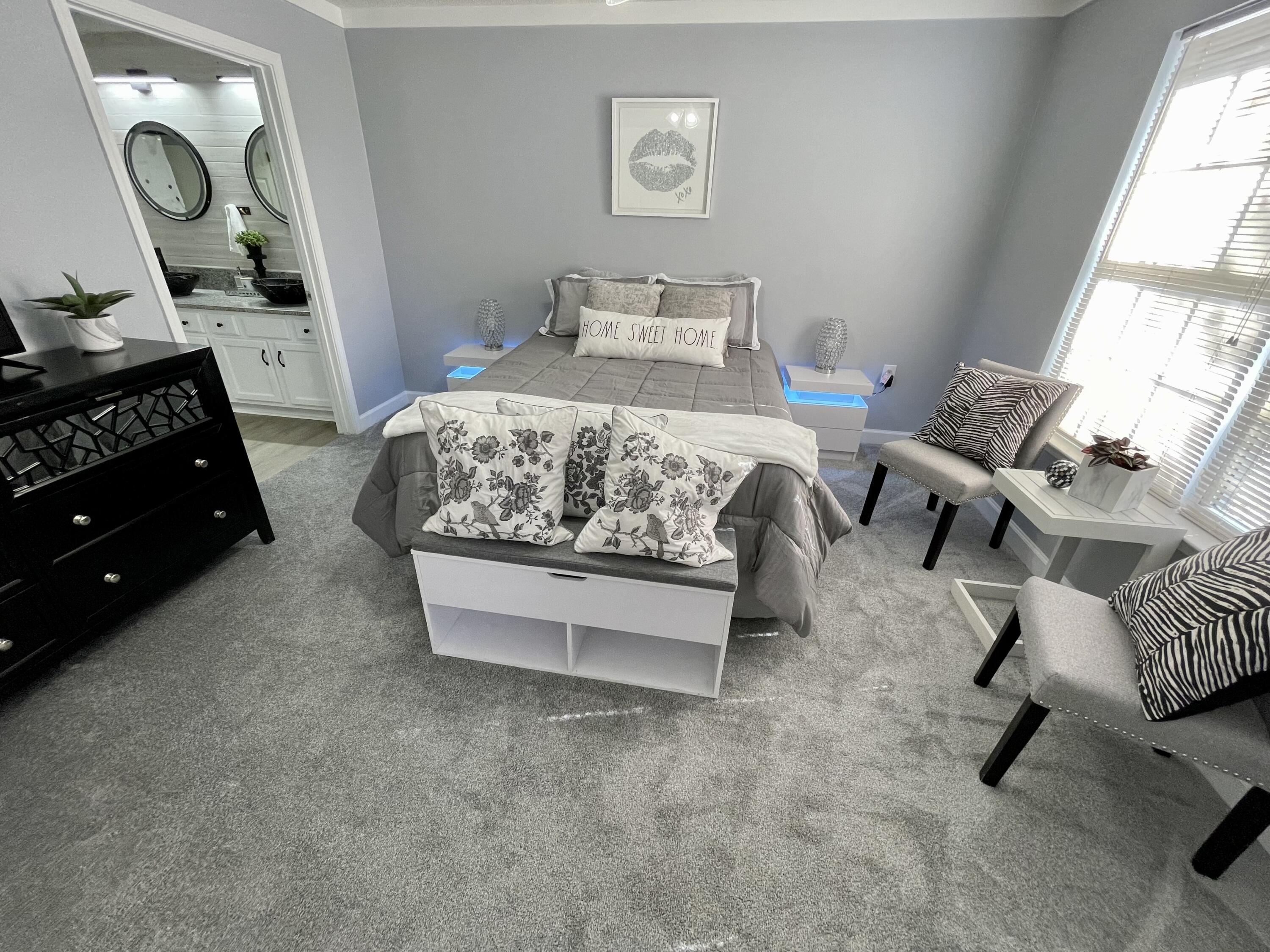 4694 Bobolink Way Crestview, FL 32539 - Photo 20 of 28 a bedroom with a bed and a dresser