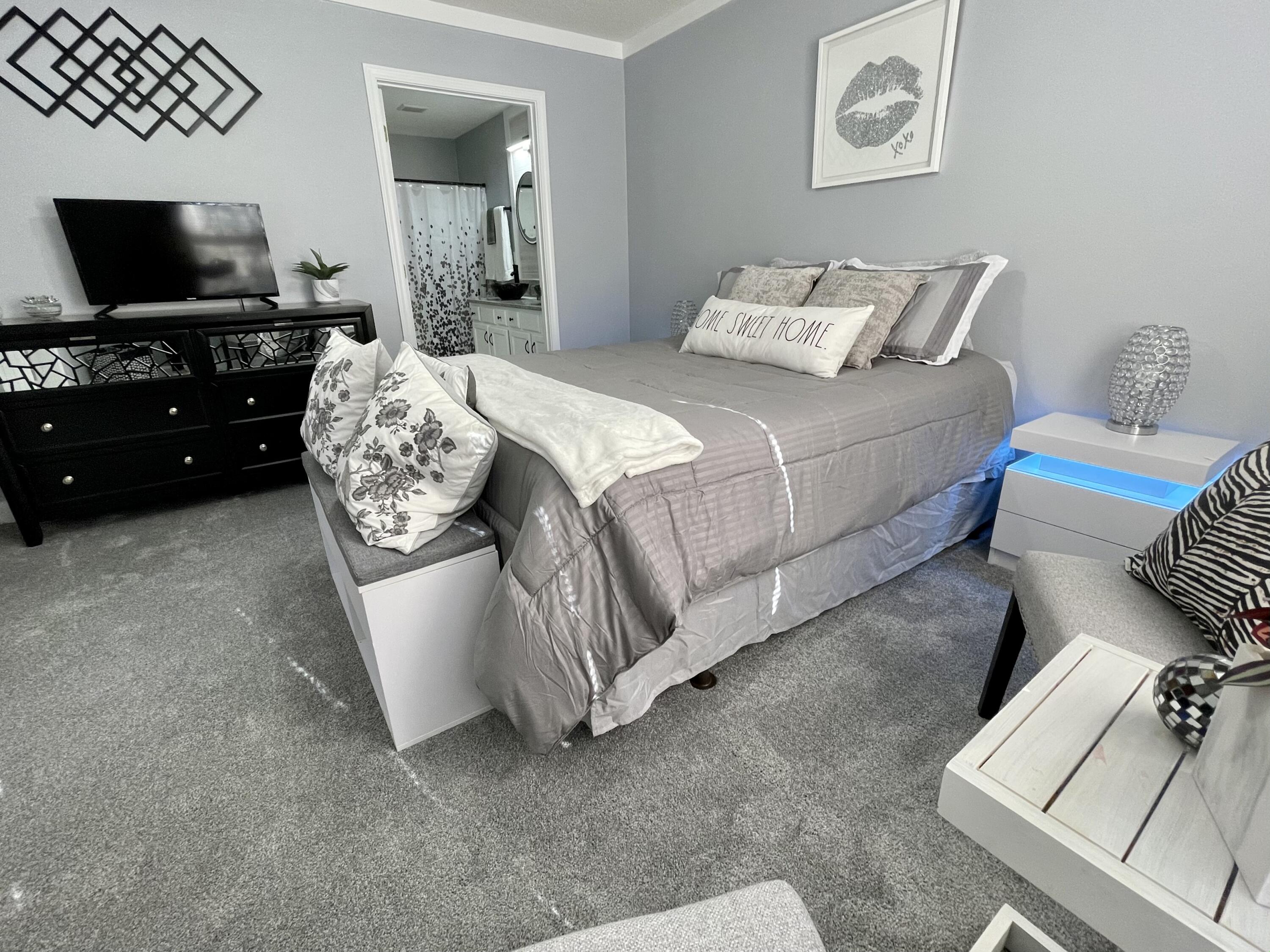 4694 Bobolink Way Crestview, FL 32539 - Photo 21 of 28 a living room with furniture and a flat screen tv