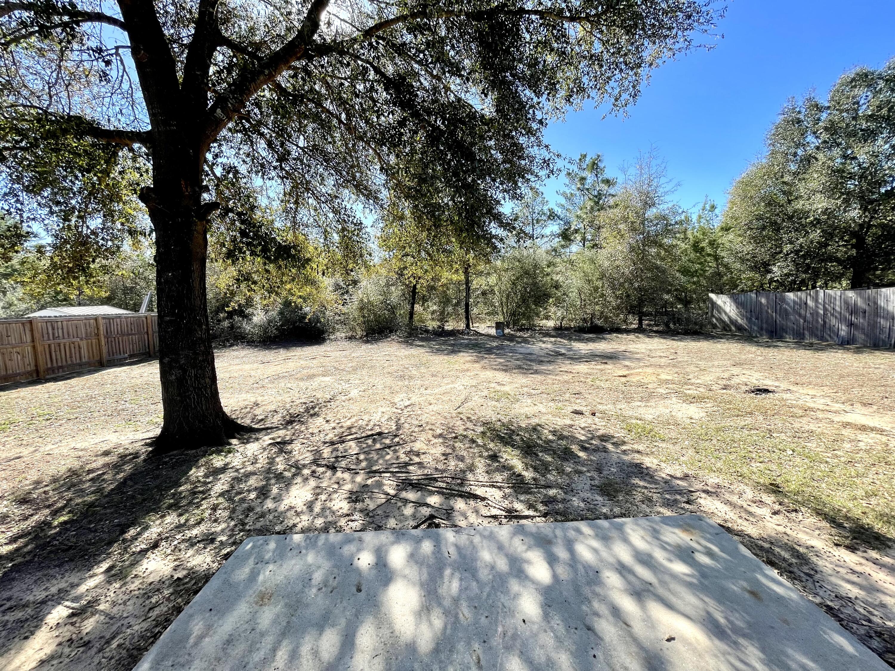 4694 Bobolink Way Crestview, FL 32539 - Photo 25 of 28 a street view covered with snow