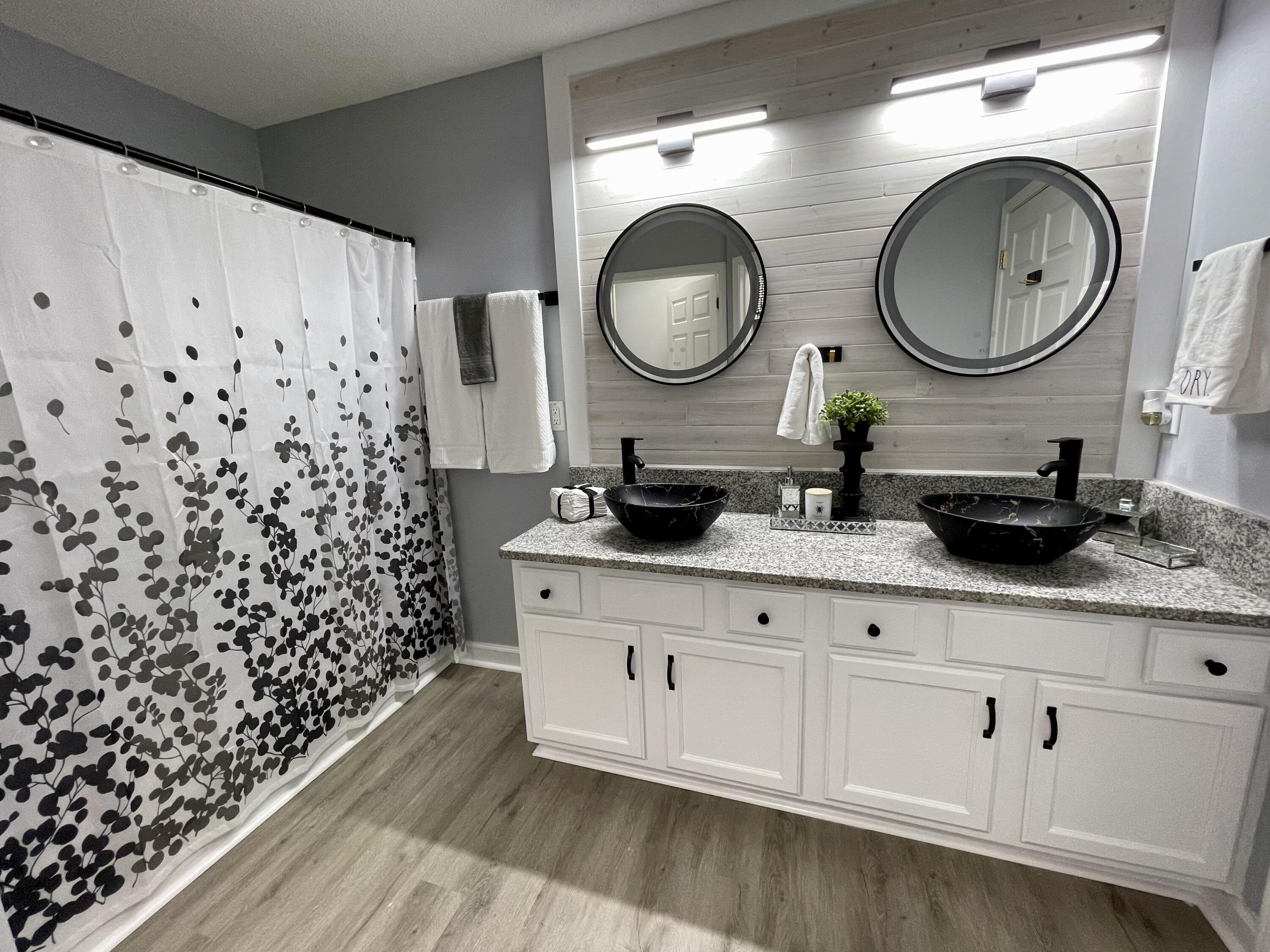 4694 Bobolink Way Crestview, FL 32539 - Photo 3 of 28 a bathroom with a sink and a mirror