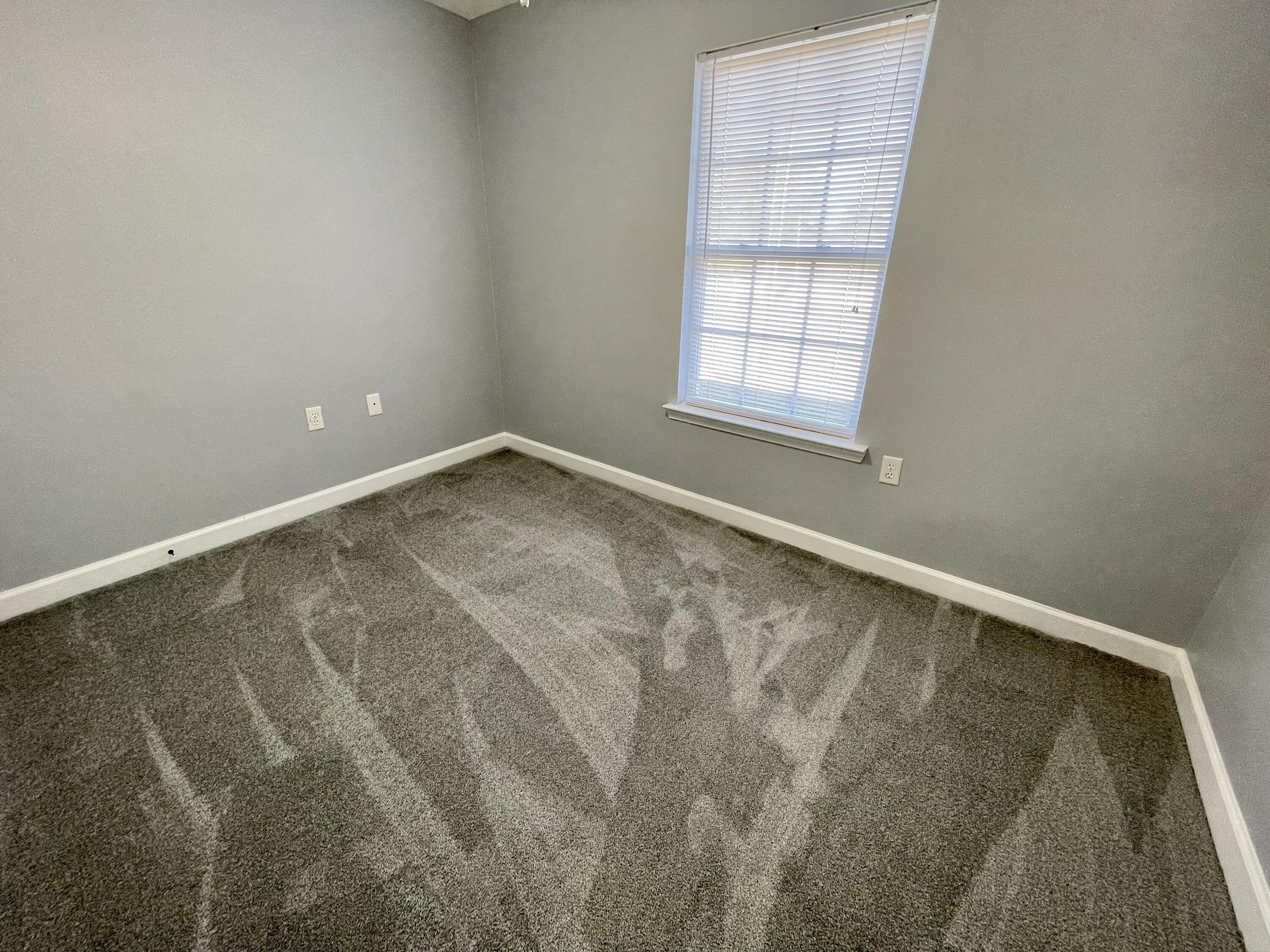 4694 Bobolink Way Crestview, FL 32539 - Photo 10 of 28 an empty room with a window