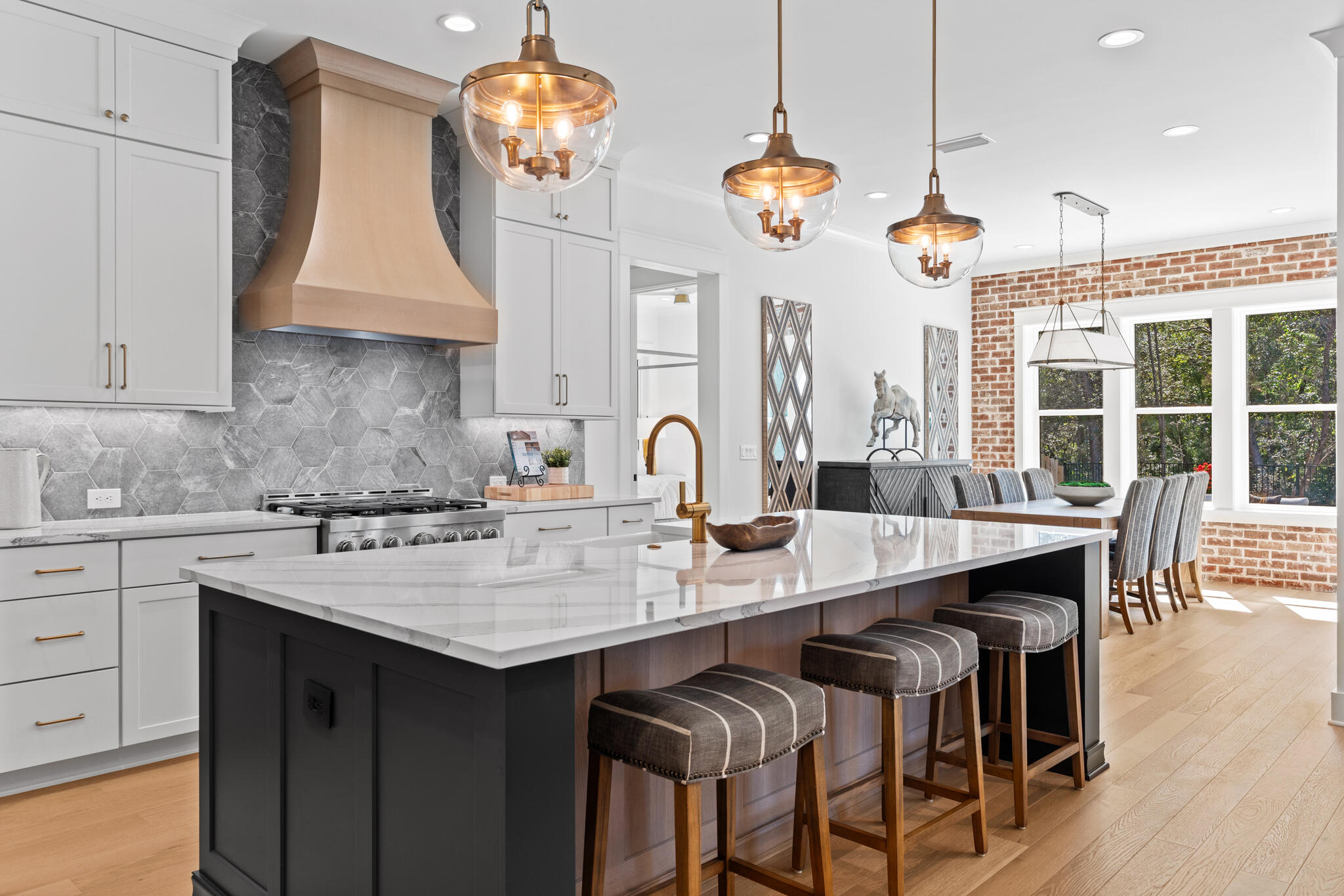 Lot 14 Shimmer Circle Freeport, FL 32439 - Photo 6 of 13 a kitchen with granite countertop a stove a sink a dining table and chairs with wooden floor