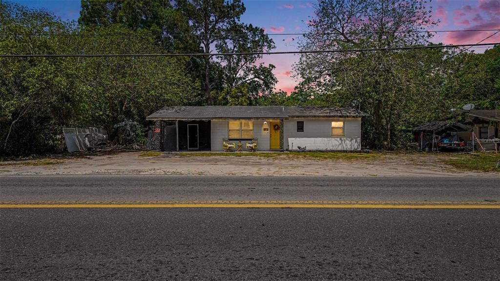 2305 Northeast 35th Street Ocala, FL 34479 - Photo 1 of 26 a front view of a house with a garden