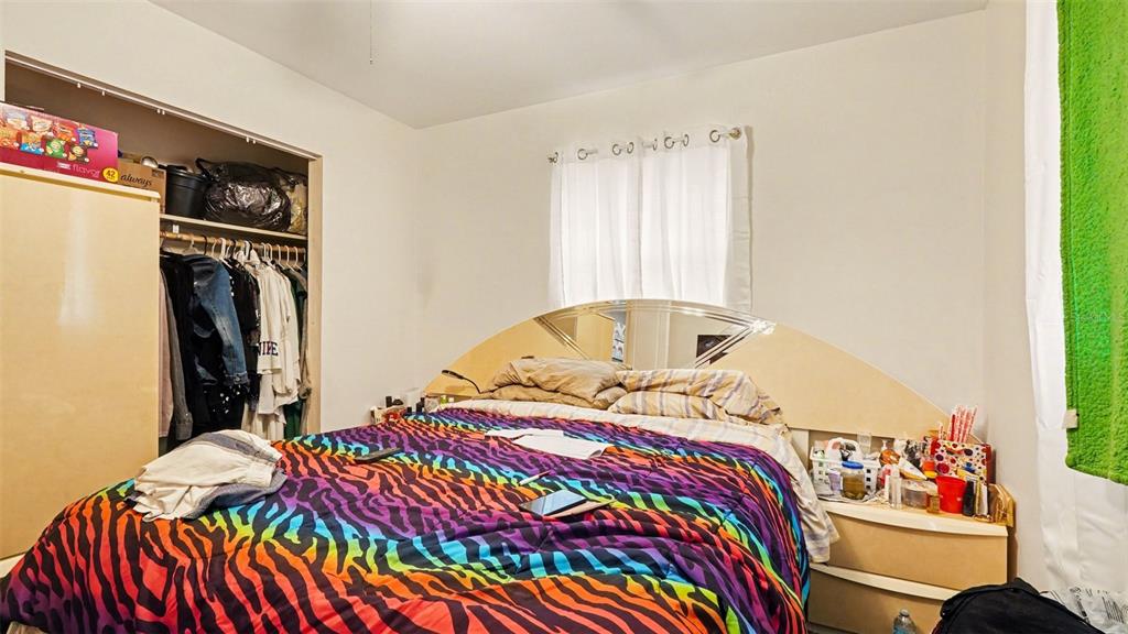 2305 Northeast 35th Street Ocala, FL 34479 - Photo 14 of 26 a bedroom with a bed and a window