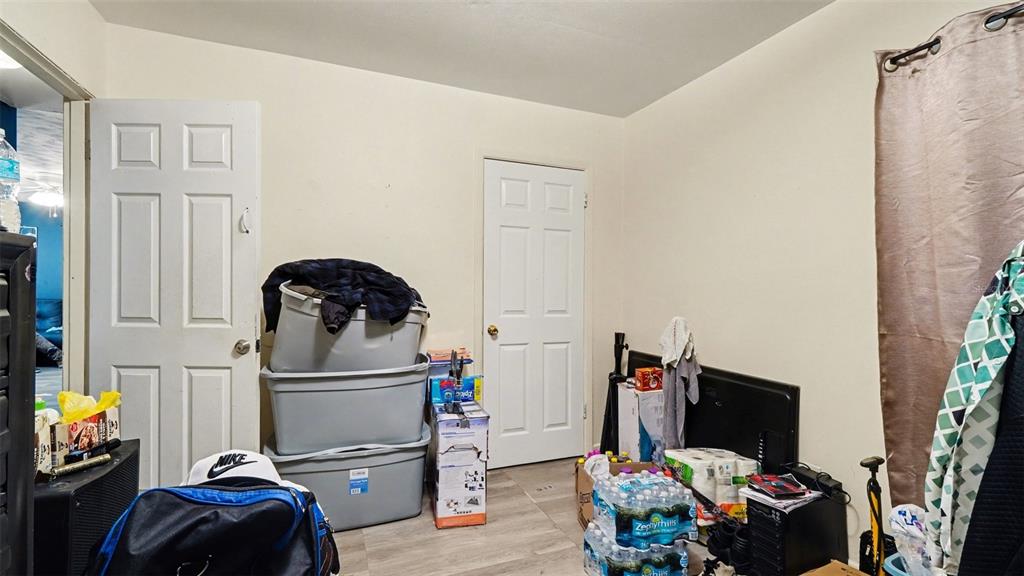 2305 Northeast 35th Street Ocala, FL 34479 - Photo 18 of 26 a bedroom with a bed and a potted plant