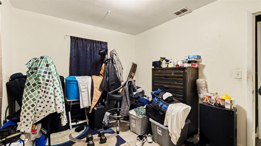 2305 Northeast 35th Street Ocala, FL 34479 - Photo 20 of 26 a view of walk in closet with clothes and shoes