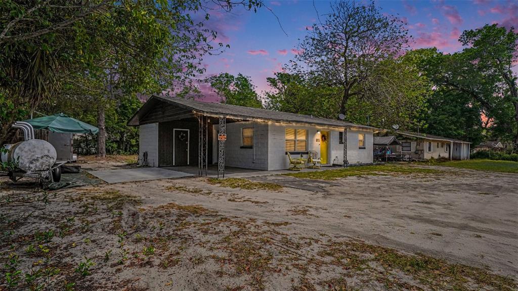 2305 Northeast 35th Street Ocala, FL 34479 - Photo 2 of 26 a front view of a house with a garden