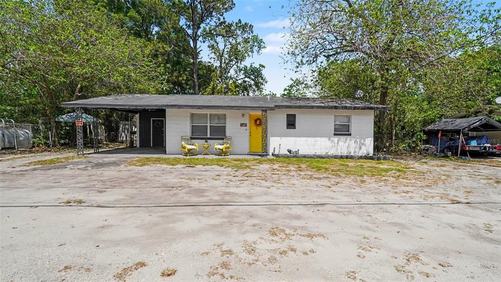 2305 Northeast 35th Street Ocala, FL 34479 - Photo 4 of 26 a house with trees in the background