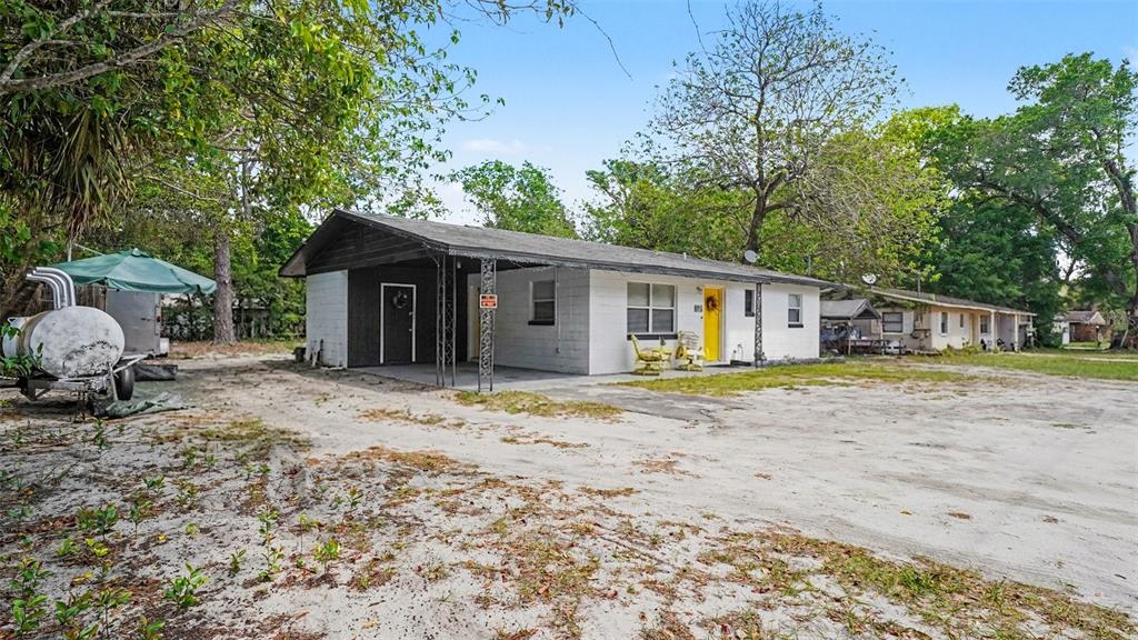2305 Northeast 35th Street Ocala, FL 34479 - Photo 6 of 26 a view of a house with a yard and large tree
