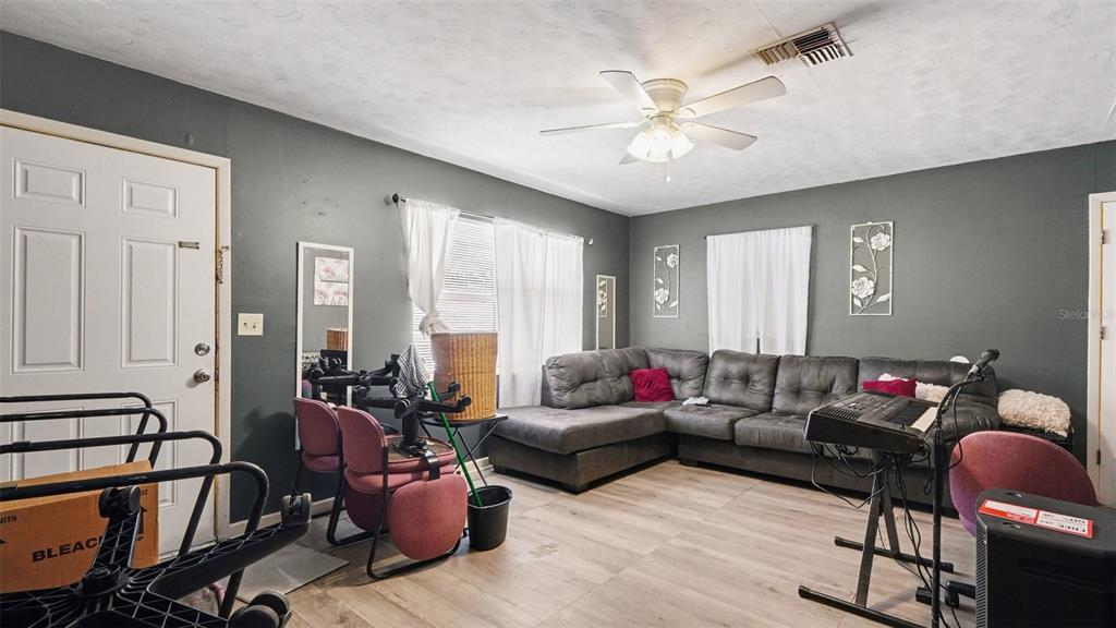 2305 Northeast 35th Street Ocala, FL 34479 - Photo 7 of 26 a living room with furniture and a large window