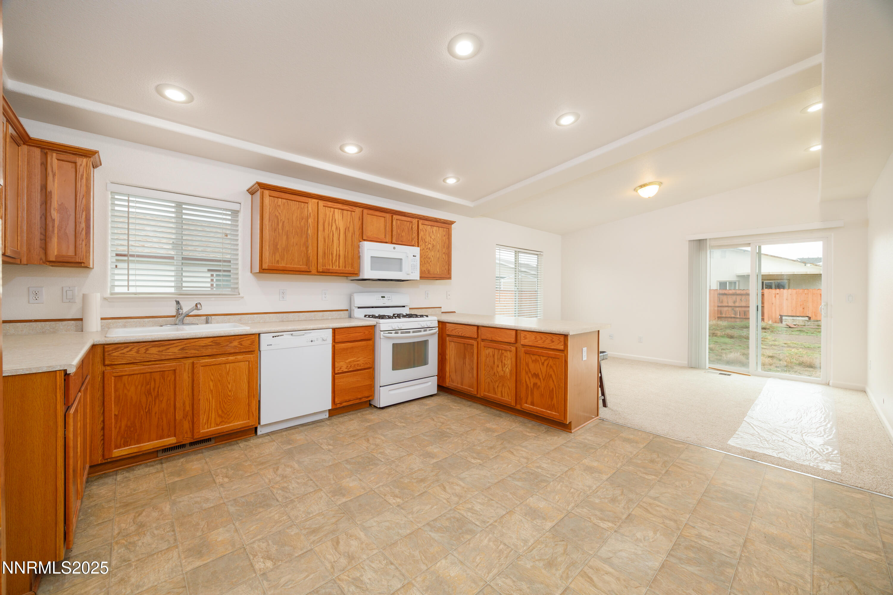 17635 Lake Powell Drive Reno, NV 89508 - Photo 11 of 23 a large kitchen with stainless steel appliances granite countertop a sink and cabinets