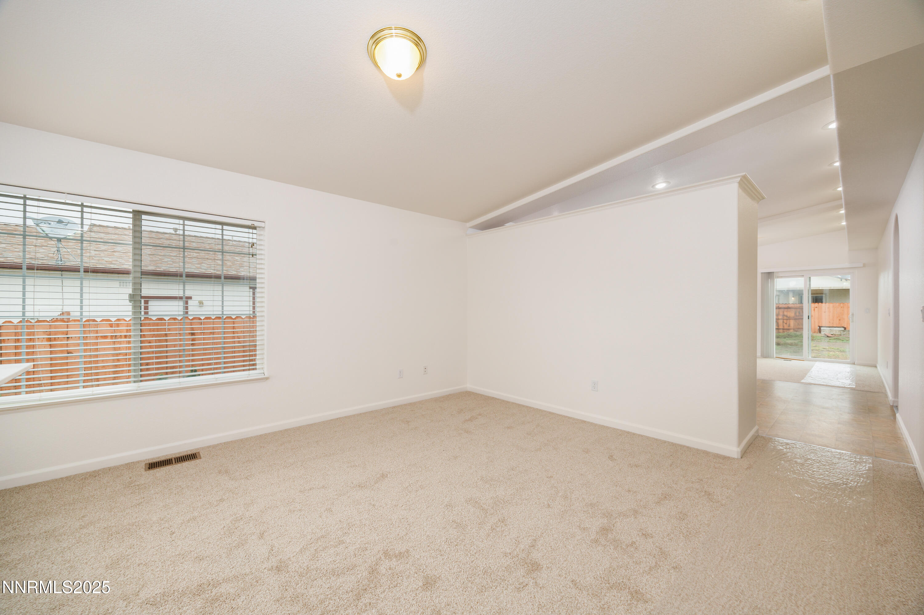 17635 Lake Powell Drive Reno, NV 89508 - Photo 13 of 23 an empty room with a empty space and windows