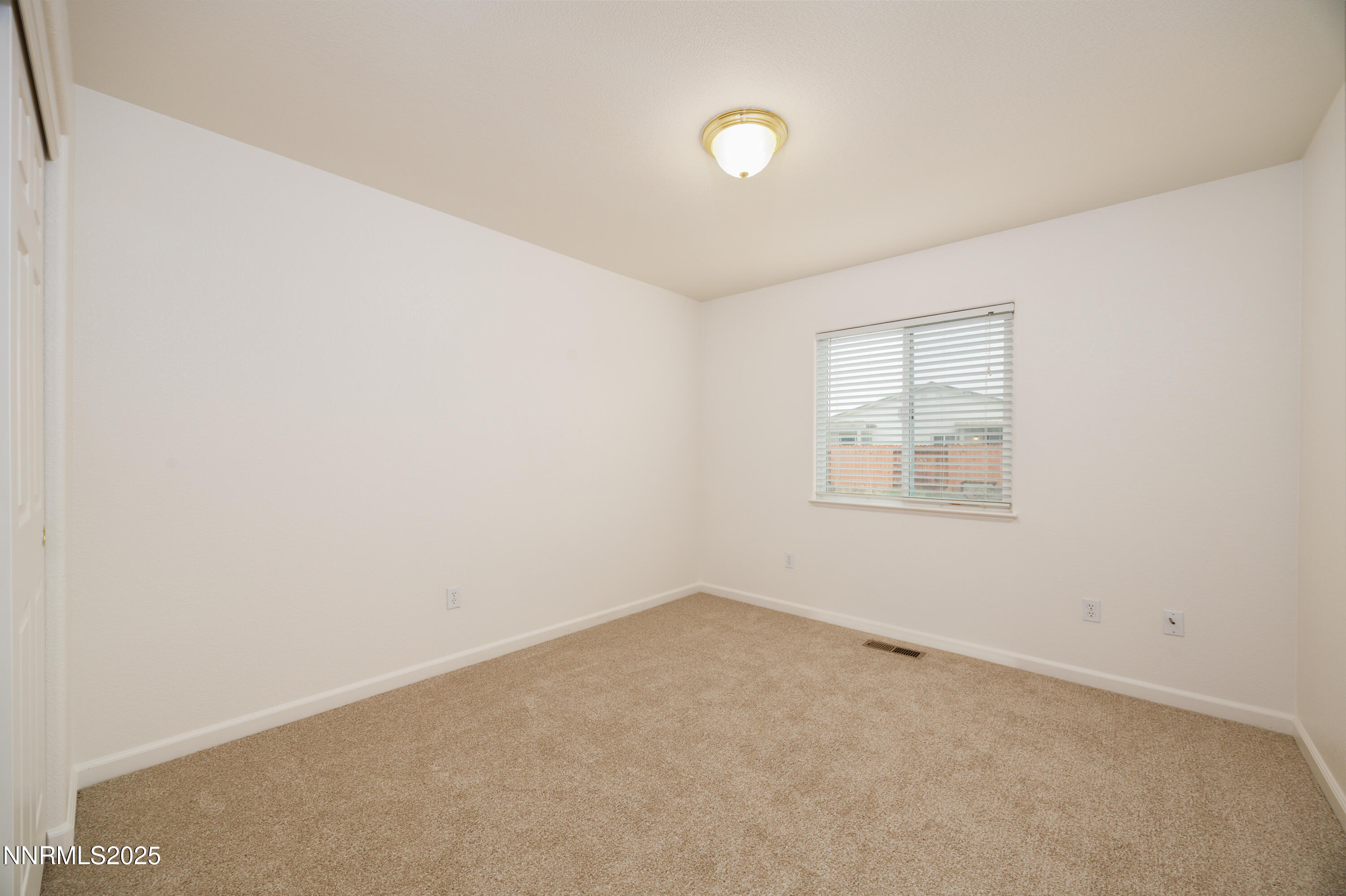 17635 Lake Powell Drive Reno, NV 89508 - Photo 15 of 23 an empty room with windows