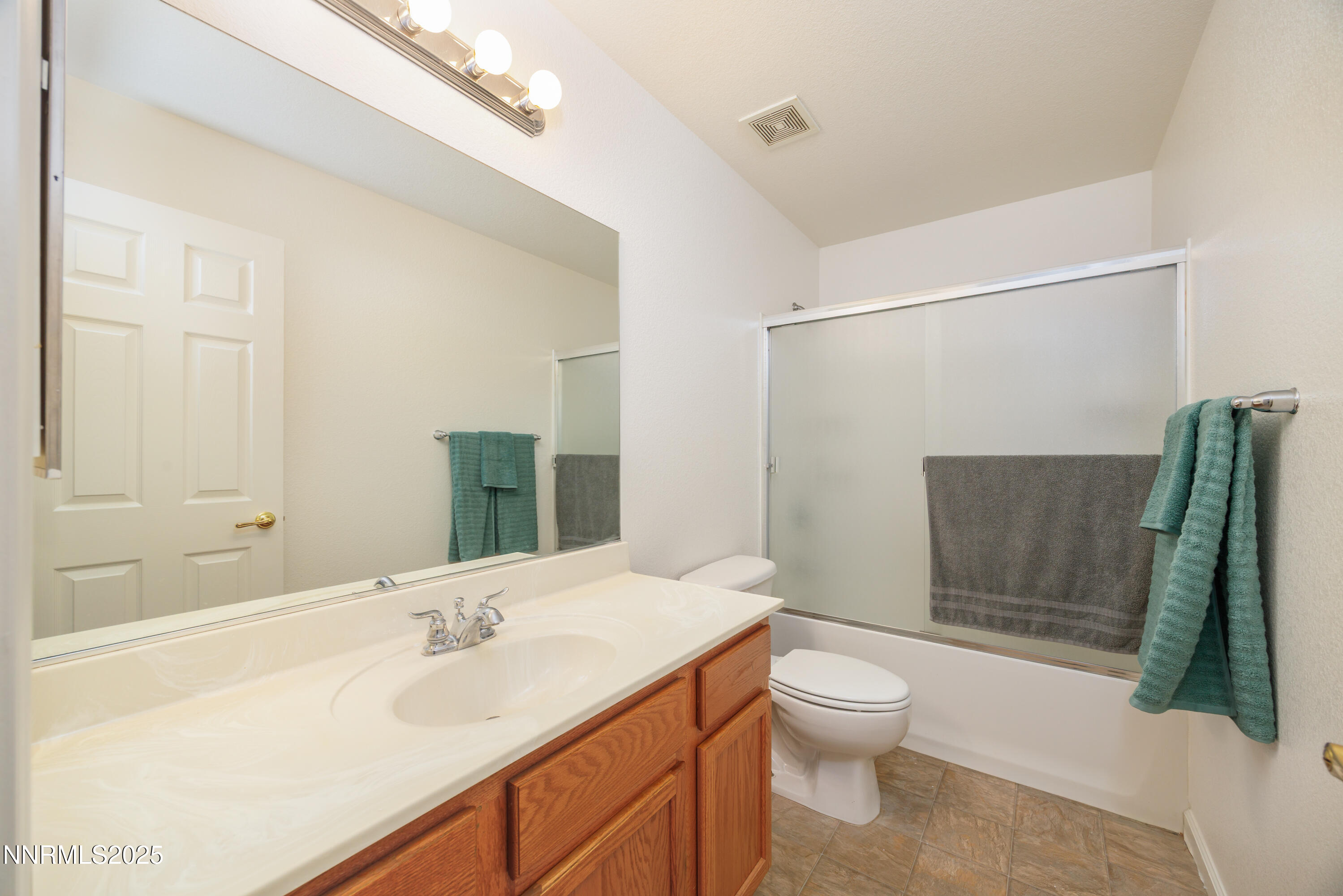 17635 Lake Powell Drive Reno, NV 89508 - Photo 16 of 23 a bathroom with a sink toilet and shower