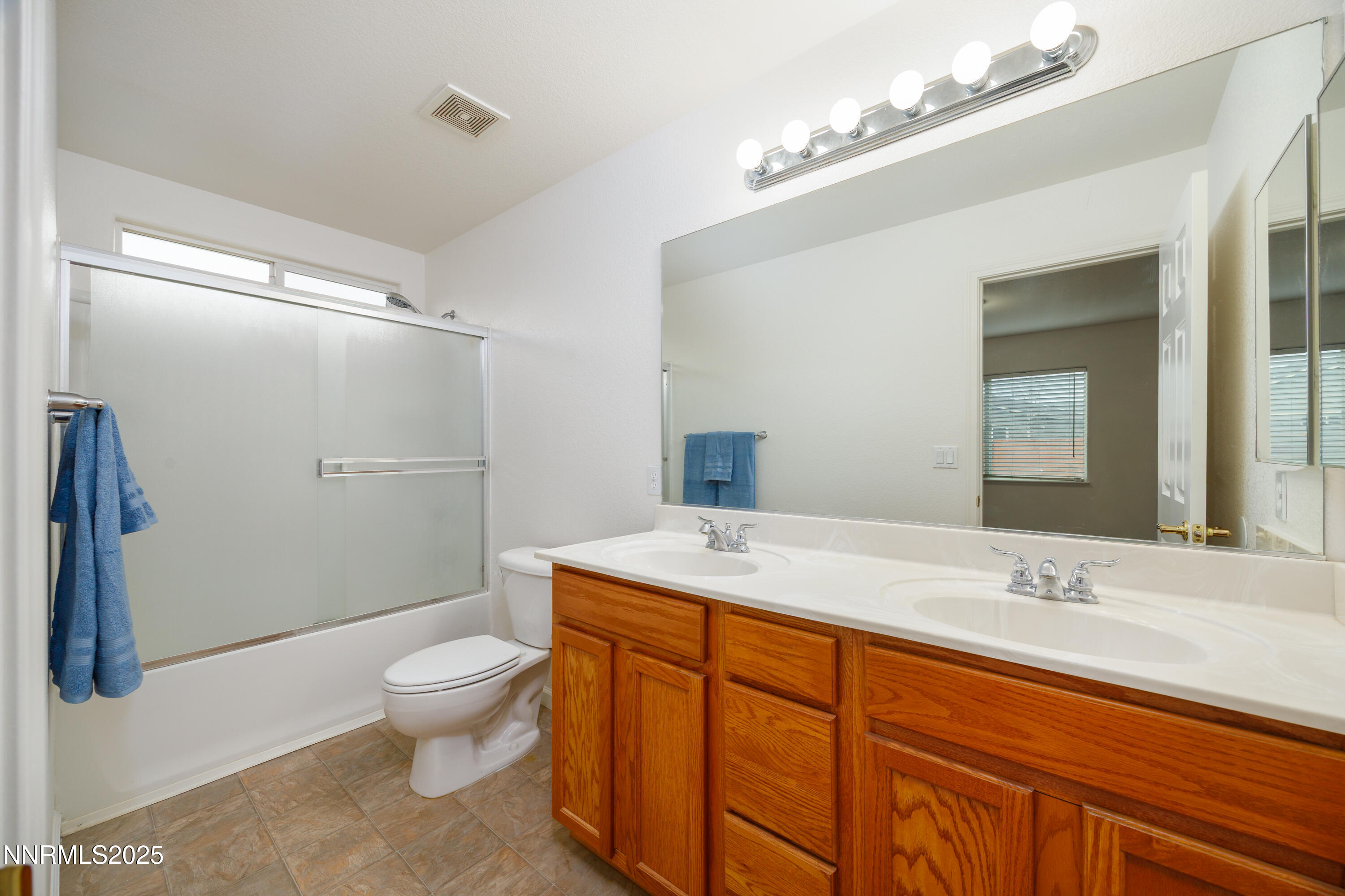 17635 Lake Powell Drive Reno, NV 89508 - Photo 19 of 23 a bathroom with a sink toilet and shower