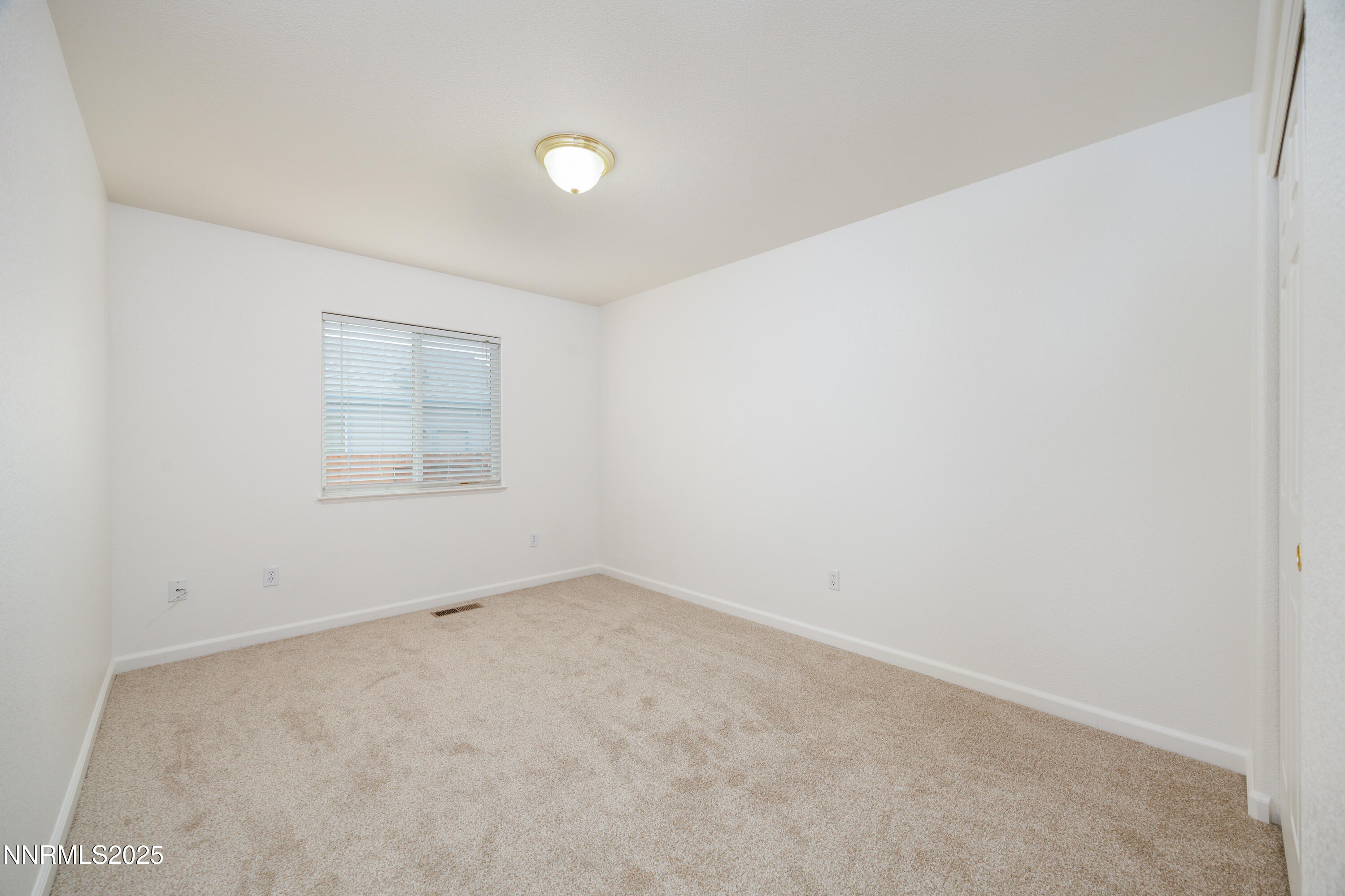 17635 Lake Powell Drive Reno, NV 89508 - Photo 20 of 23 an empty room with windows