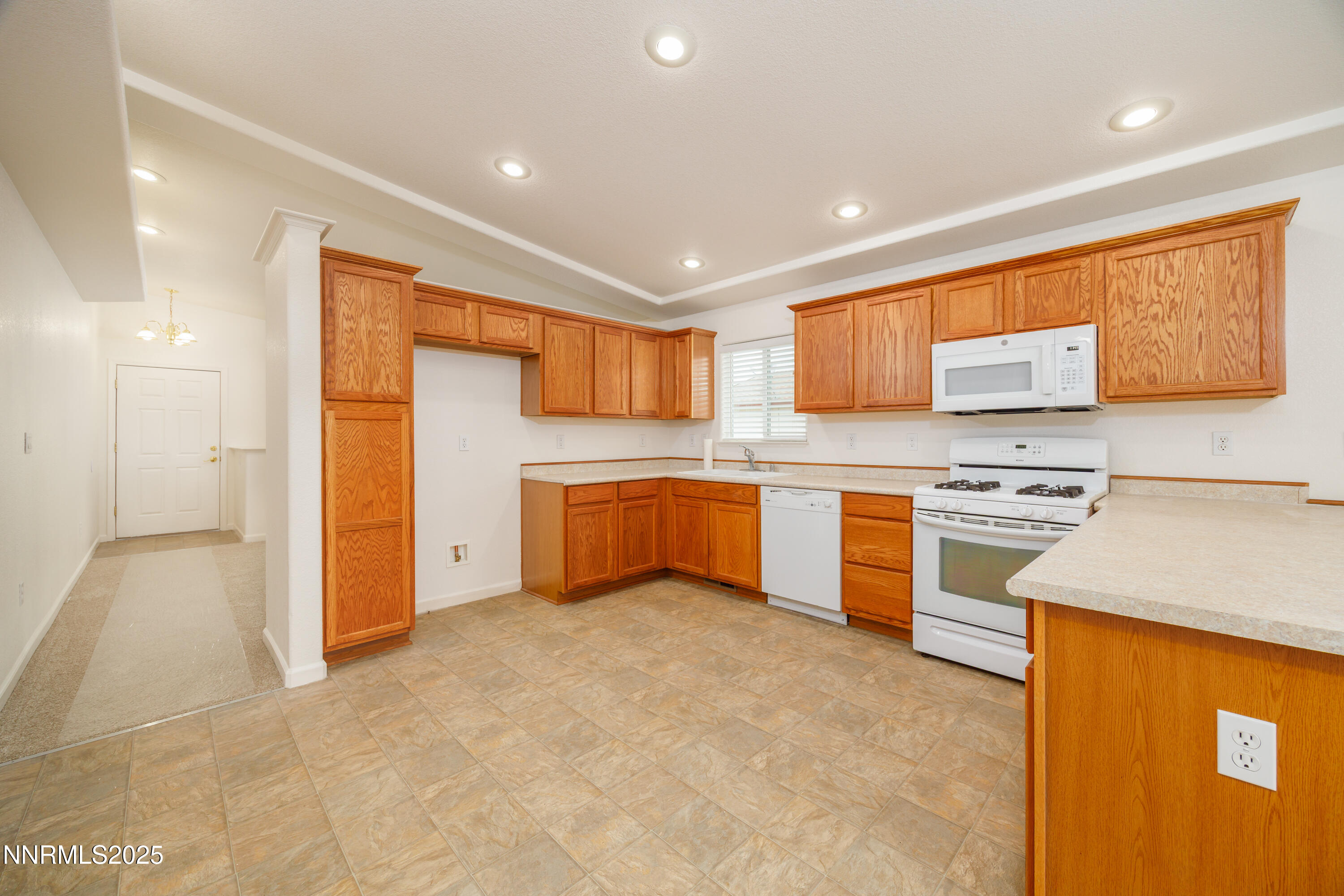 17635 Lake Powell Drive Reno, NV 89508 - Photo 3 of 23 a kitchen with a stove a sink and a refrigerator