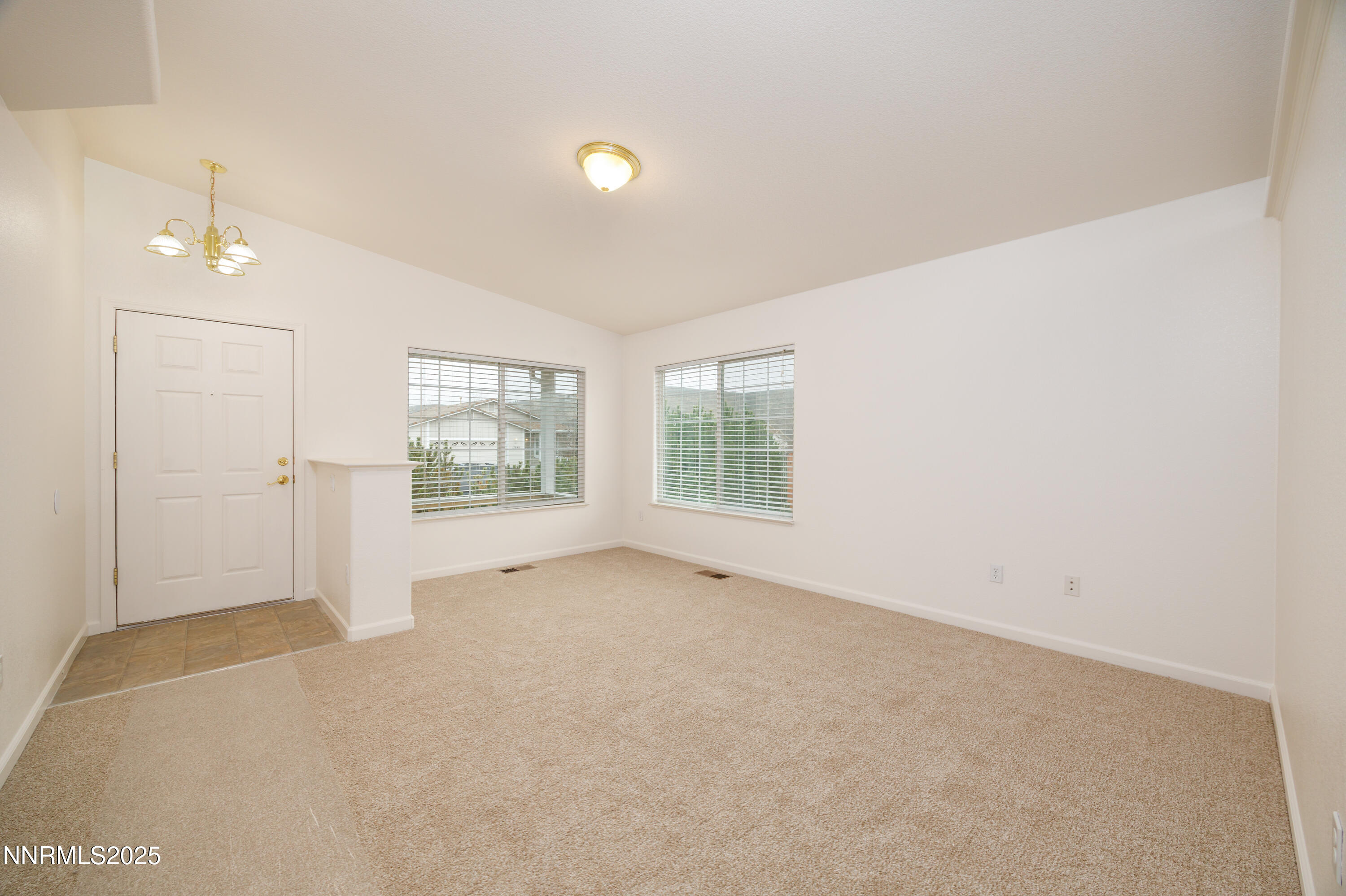 17635 Lake Powell Drive Reno, NV 89508 - Photo 4 of 23 an empty room with windows