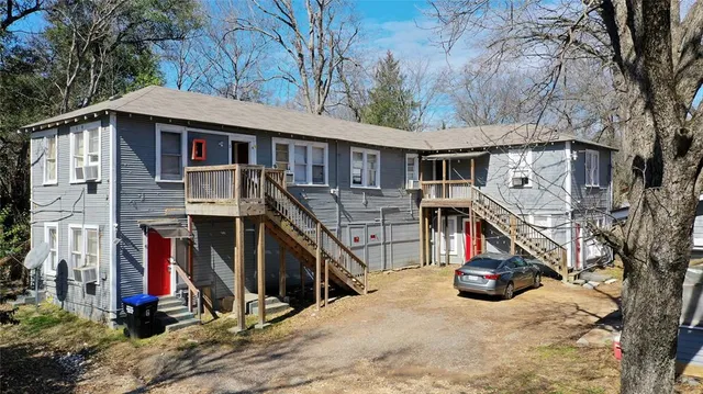 a view of a house with a snow on the road