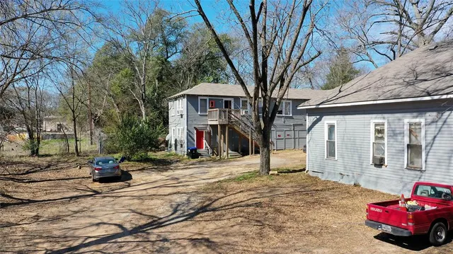 a view of a house with snow on the road