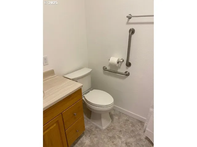 a bathroom with a toilet and a sink