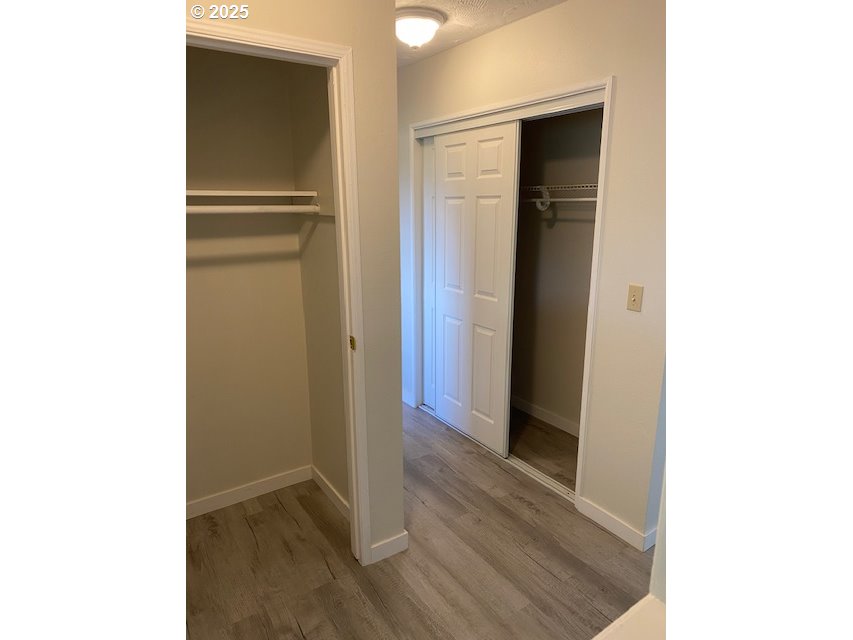 82277 Davisson Road Creswell, OR 97426 - Photo 18 of 48 a view of a hallway with wooden floor