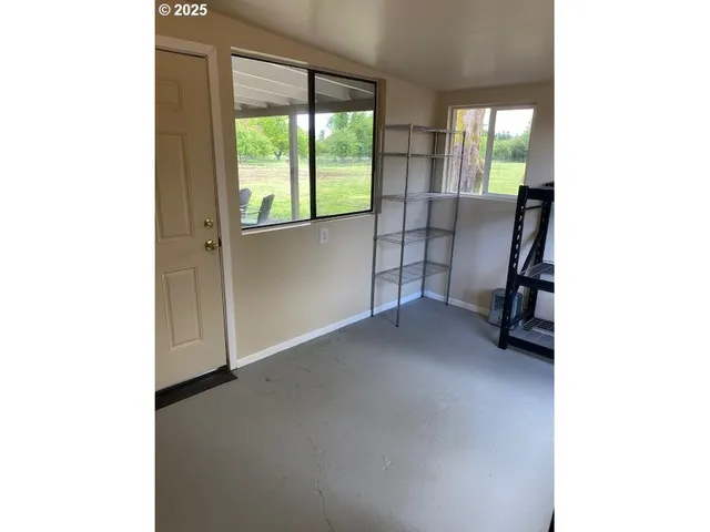 a view of a room with a large window